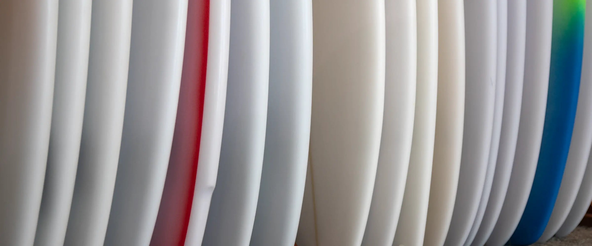 Lineup of surfboards in an HIC surf shop