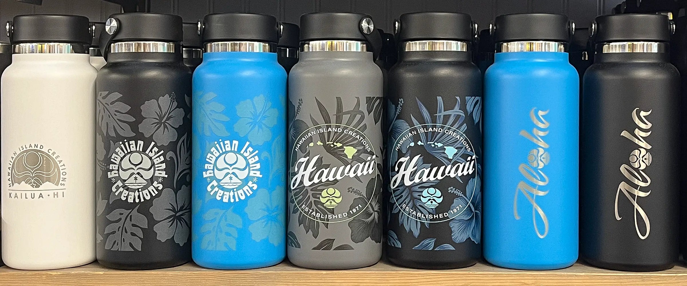HIC x Hydro Flask bottles lined up on a store shelf