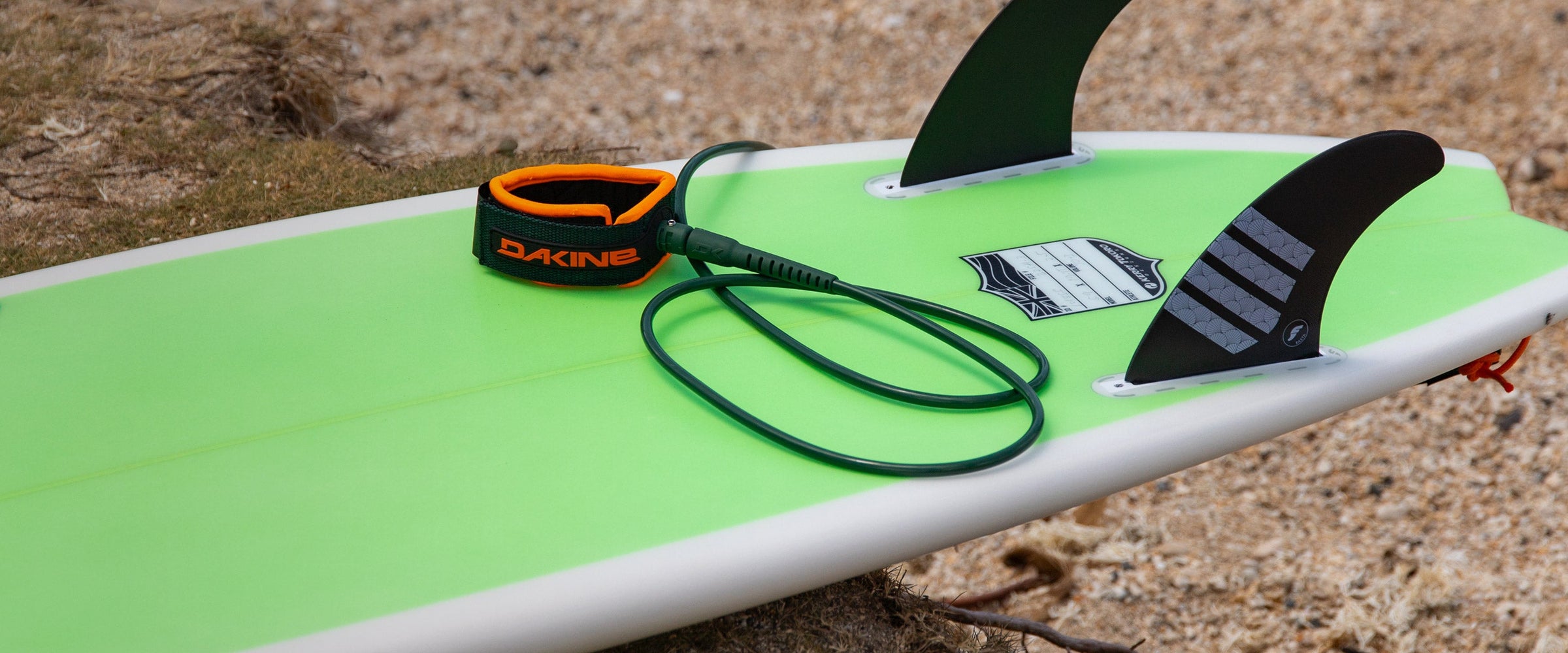 HIC Surfboards with Dakine leash on the beach