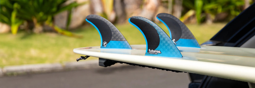 Surfboard with Future Fins in the back of an SUV